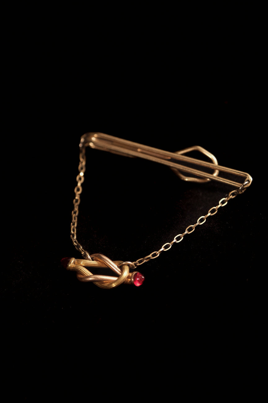 1930s 12Kt. "Rolled Plate" Tie Bar With Ruby Glass Knot Detail