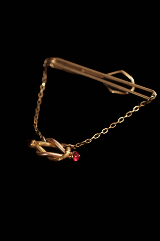 1930s 12Kt. "Rolled Plate" Tie Bar With Ruby Glass Knot Detail